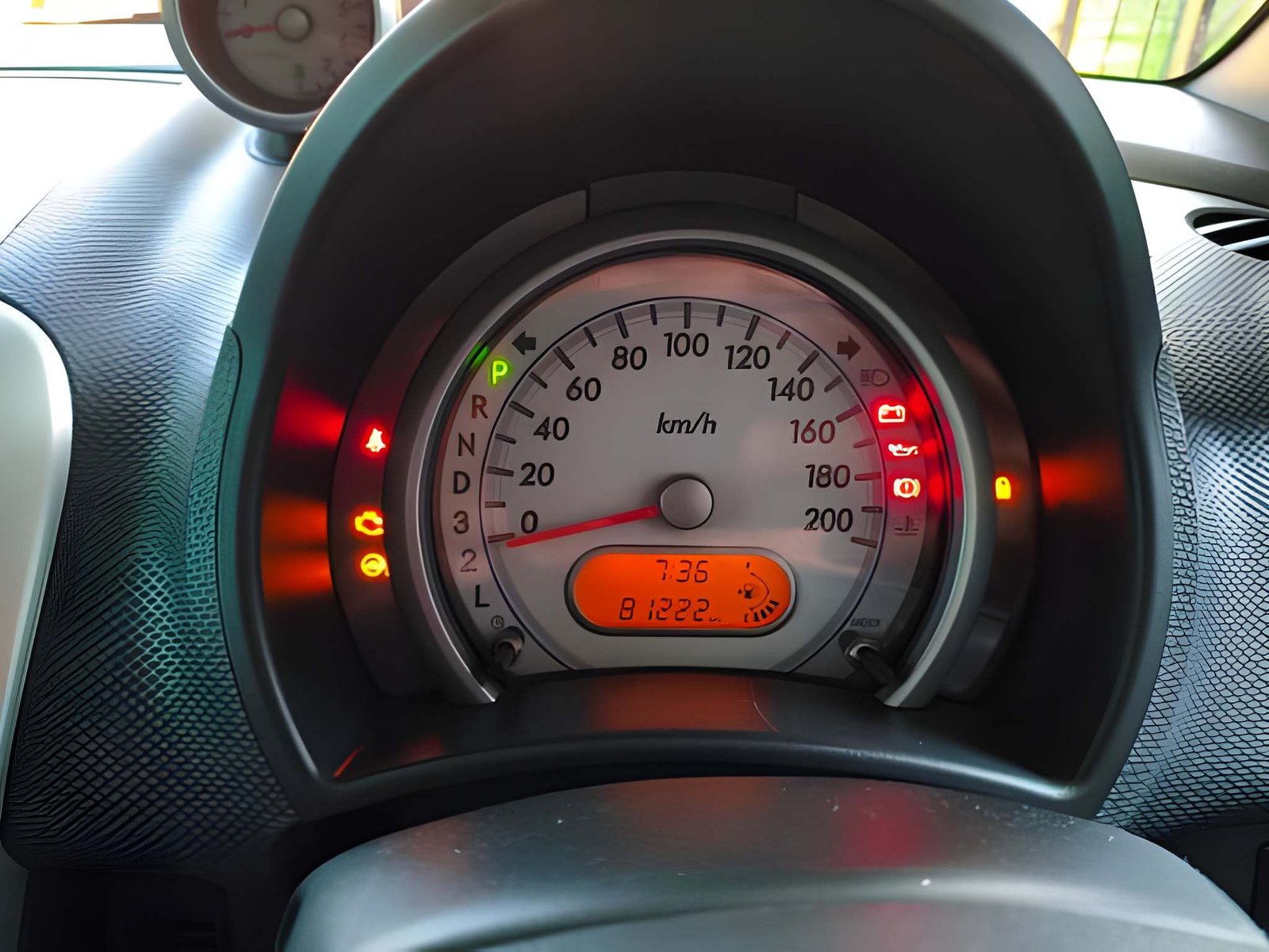 What do my car’s dashboard warning lights mean, and what should I do?